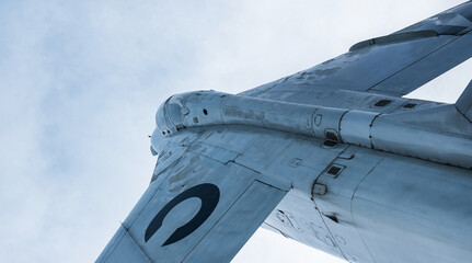 Fighter jet with blue sky in background.