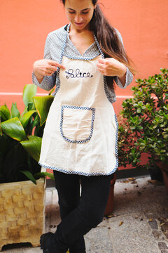 Young woman with a personalized apron