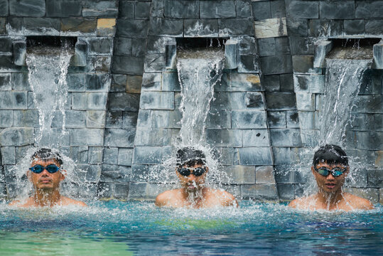 Asian sport man swimming in the pool.