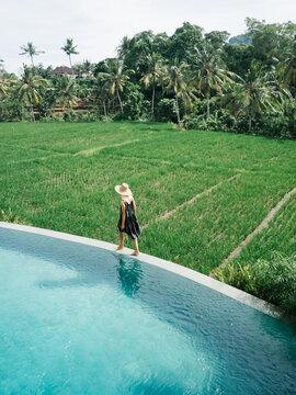 Female walking on poolside