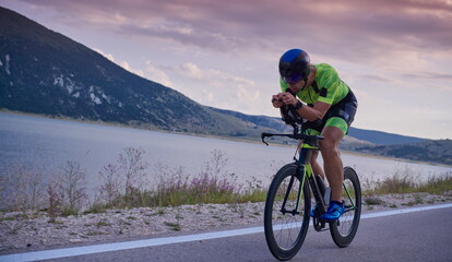 Fototapeta premium triathlon athlete riding bike