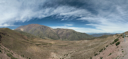 Panoramic of the Andes mountain range. Aerial view of the hills and green meadow of the famous landmark Bishop's slope in Salta, Argentina.