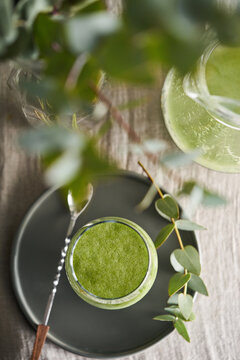 Freshly made green detox juice in a glass.