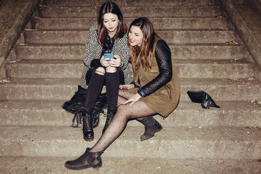 Girls Taking Self Portraits with a Mobile Phone