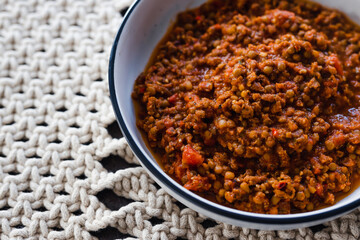 plant-based food, vegan bolognaise ragu sauce with lentils diced tomatoes and textured vegetable protein with mixed herbs and spices