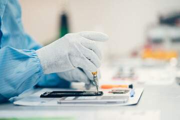 Man repairing smartphone.