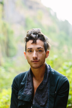 Man Wearing Gold Leaf Makeup in Forest