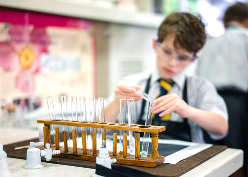Row of test tubes in a rack in a science classroom