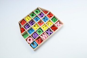 Colorful block letters in the compartment on white background