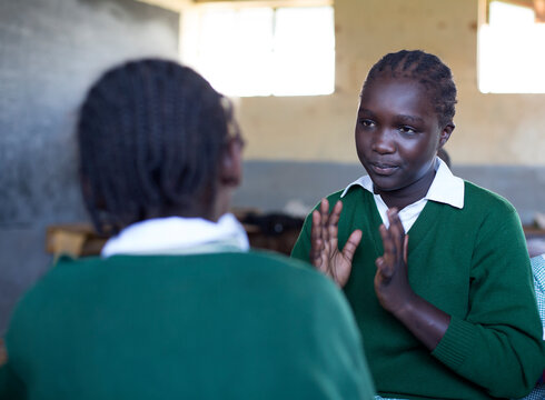Deaf school children learning sign language