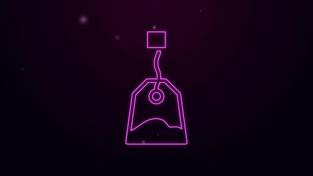 Glowing neon line Tea bag icon isolated on purple background. 4K Video motion graphic animation.
