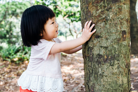 Asian little girl playing outdoor