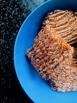 Noodles Fresh Out Of A Package In A Bowl.