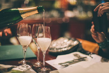 Meeting and celebration of busines in a restaurant with champagne.