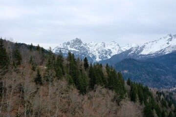 aerial snow covered mountain peaks in alps at winter 