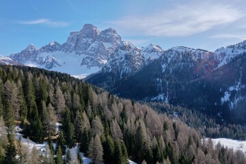 aerial snow covered mountain peaks in alps at winter 