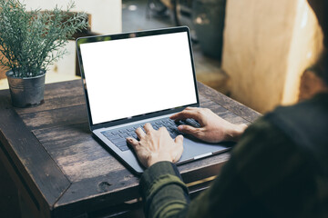 computer mockup blank screen.hand woman work using laptop with white background for advertising,contact business search information on desk at coffee shop.marketing and creative design