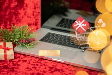 Obraz na płótnie Canvas Blurred image. Concept online shopping buying presents.Yellow credit card, laptop and christmas presents. Business christmas holidays concept, holiday gift online shopping concept. 