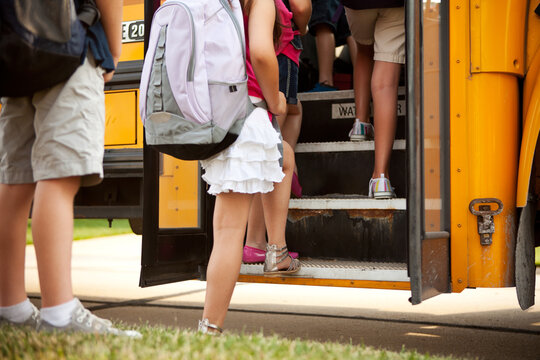 School Bus: Anonymous Kids Get On Bus