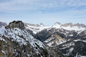 aerial snow covered mountain peaks in alps at winter 