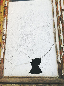Boken window in man shaped