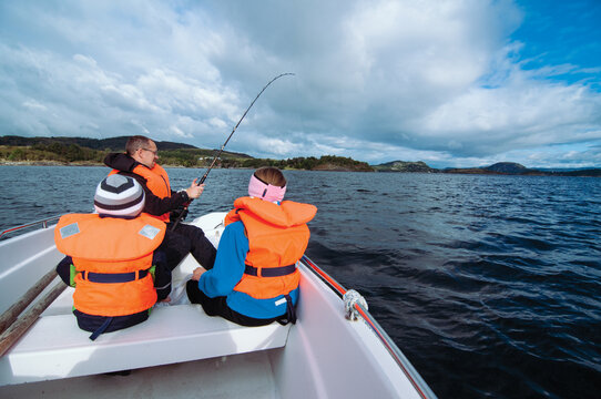 Kids Fishing Boat Images – Browse 21,308 Stock Photos, Vectors, and Video