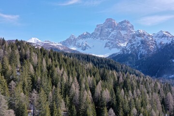 aerial snow covered mountain peaks in alps at winter 