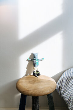 Small puppet on a stool