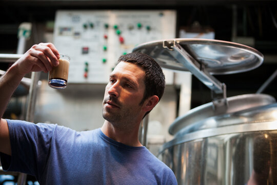 Beer: Brewer Waiting For Foam To Dissolve On Sample
