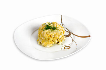 Appetizer of eggs and processed cheese with garlic and mayonnaise on the plate isolated on a white background.