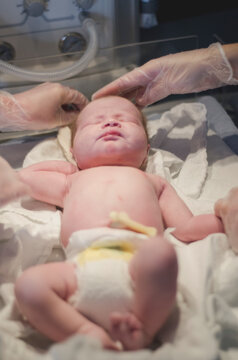 A Newborn Baby is Examined in the Moments After Birth