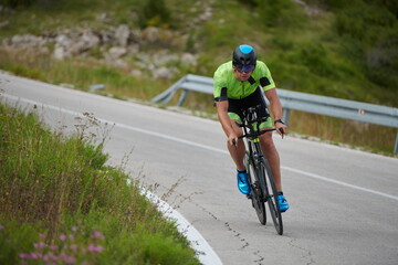 Fototapeta na wymiar triathlon athlete riding bike
