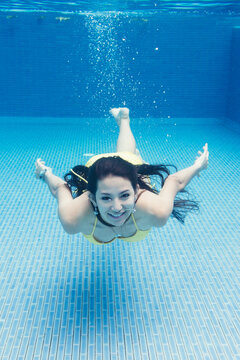 Underwater view of woman diving