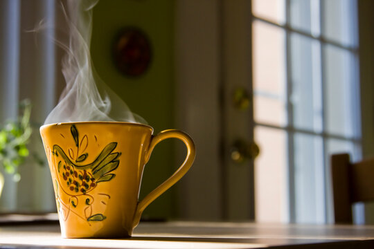 Steam Rising out of Mug on Kitchen Table