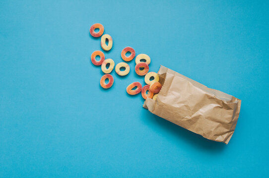 Colorful gummies on the blue background