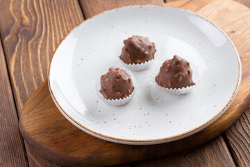 Small chocolate sweets with nuts close up