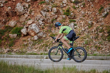 Fototapeta premium triathlon athlete riding bike