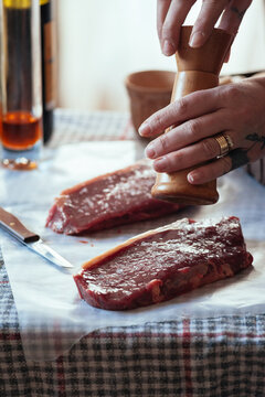 Seasoning meat.