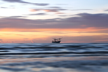 Landscaped of fisherman boat in the moring with sunrise sky.