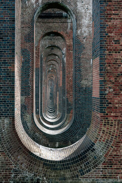 Receding interior arched columns of a railway viaduct