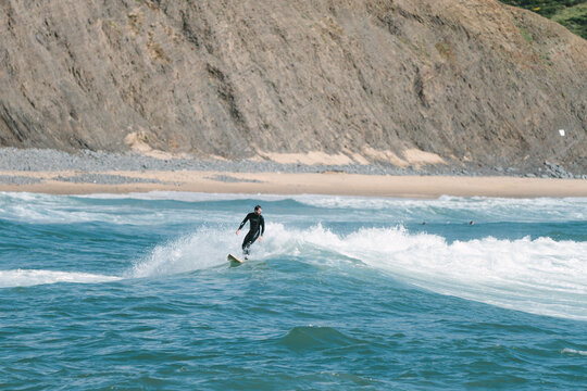 surfer finishing a surfed wave