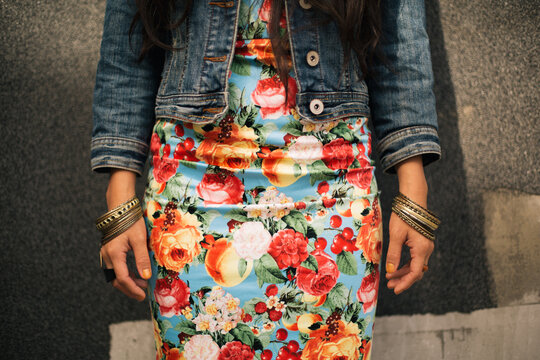Woman in tropical print dress.