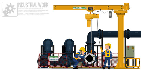 Two workers are operating jib crane for maintenance pump system