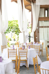 wedding dining table setup using gold chiavari chair