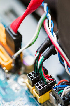 Colourful computer wires and socket on PC