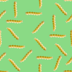 Fusilli pasta random flat lay on green background without shadow. can be used as raw pasta background, poster, banner not pattern.