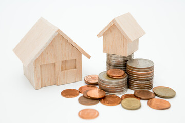 Model house, coins stack on white background  for money saving concept