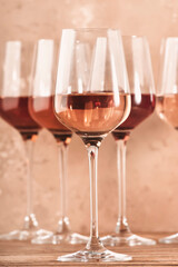 Rose wine glasses assortment on wine tasting. Degustation different varieties, colors and shades of...