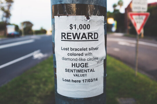 Reward sign stick in a pole