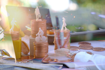 Double exposure, business working a smartphone and coins stacked background and advertising coins of finance and banking, increasing columns of gold coins on table